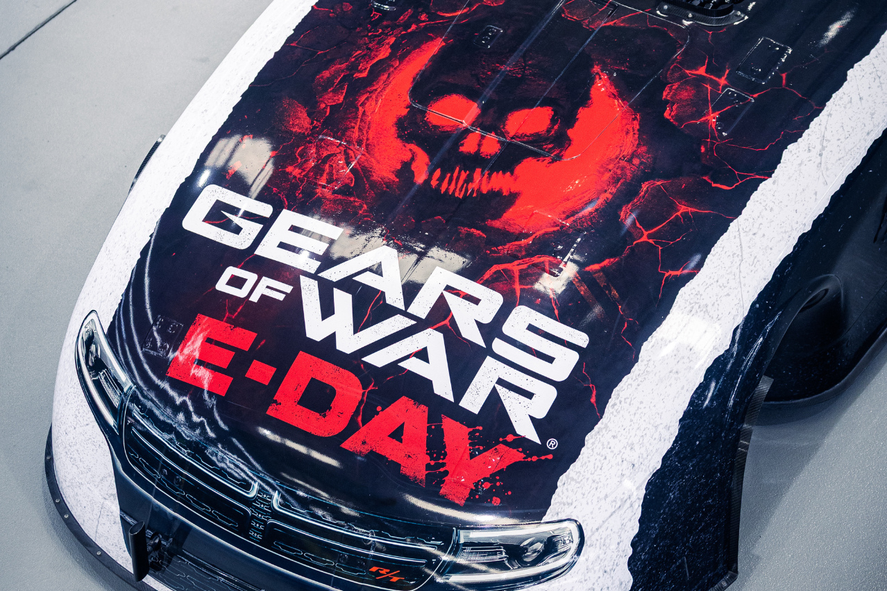 Overhead close-up of the Xbox Gears of War: E-Day Nitro Funny Car livery and red skull bonnet artwork.