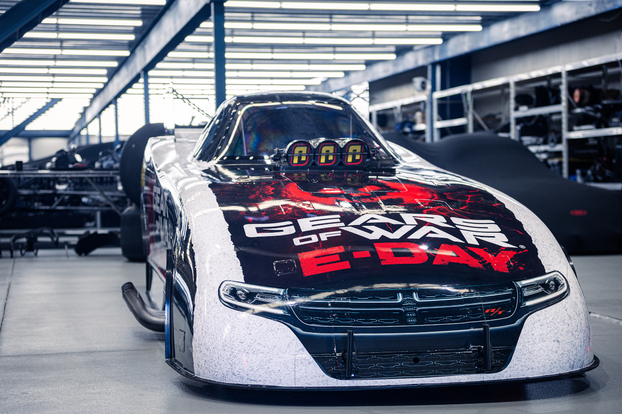 Low front view of the Xbox Gears of War: E-Day Nitro Funny Car displaying its black, white and red NDRC livery.