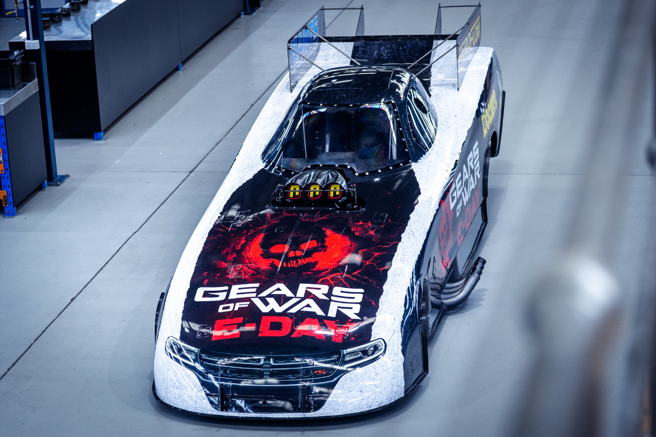 Overhead front view of the Xbox Gears of War: E-Day Nitro Funny Car featuring the skull bonnet artwork and NDRC livery.